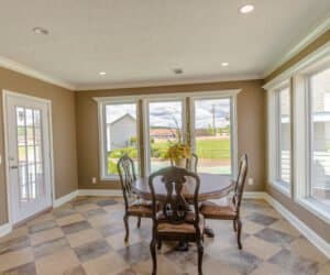 Furnished Dining room with large windows from Pratt Homes, Tyler, Texas