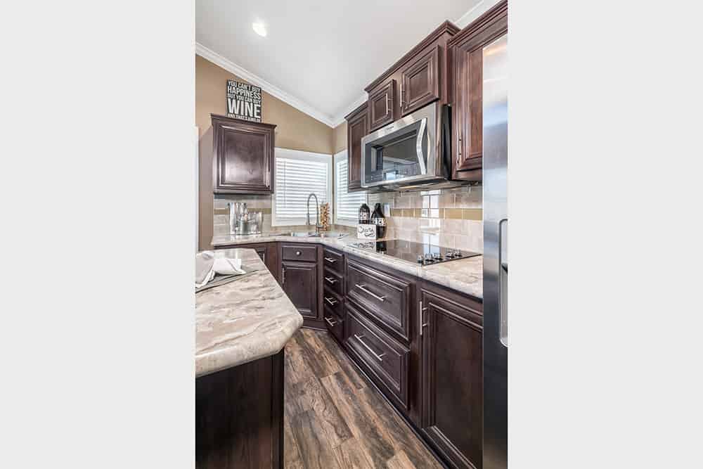 Furnished kitchen from house model APH 630 made by Pratt Homes, Tyler, Texas