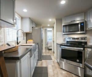 Kitchen of incredible tiny home Seaside made by Pratt Homes Tyler, Texas