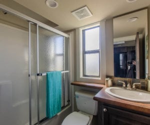 affordable tiny home Brown bathroom Pratt Homes, Tyler, Texas