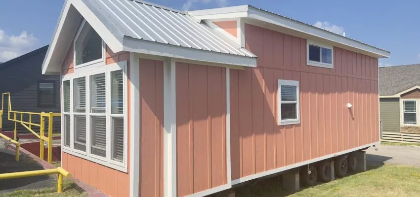 An orange manufactured home by Pratt Homes.