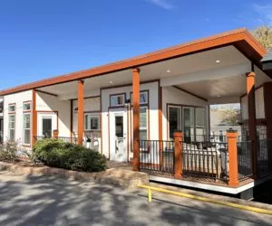 image of a tiny home with wrap around porches